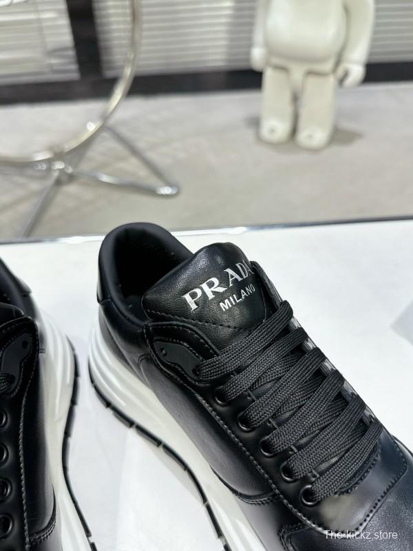 2025 Unisex Prada Black Leather Sneakers KFY00310